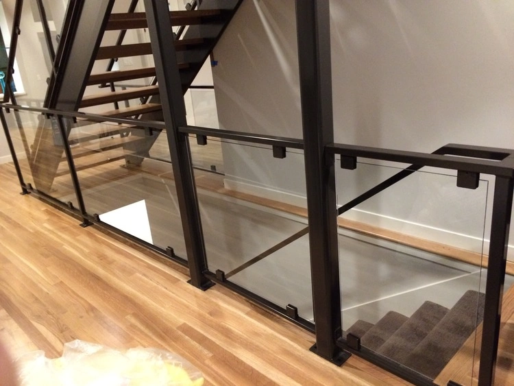 Stylish glass and cable railing system offering a contemporary design for the staircase.